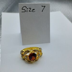 Elegant Gold Ring with Red Gemstone